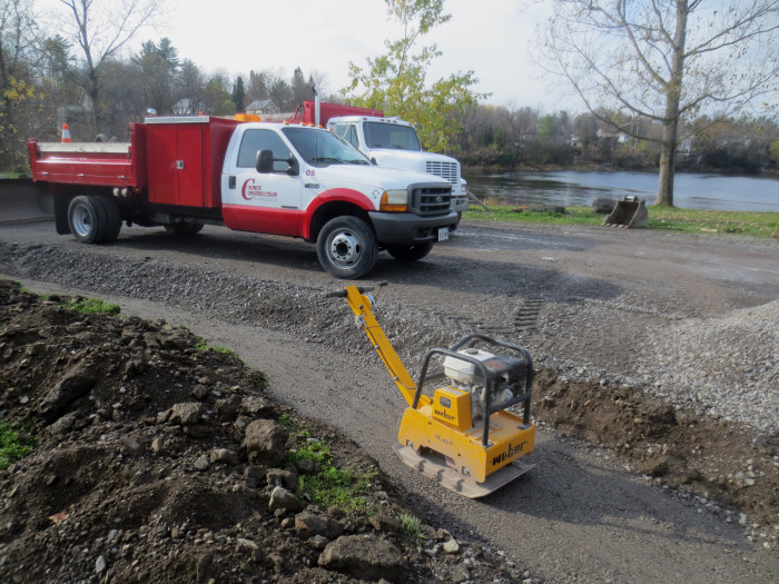 While work on the relocation of the Metcalfe Geoheritage Park specimens continues, construction is also underway for paving the adjacent parking lot and boat launch.